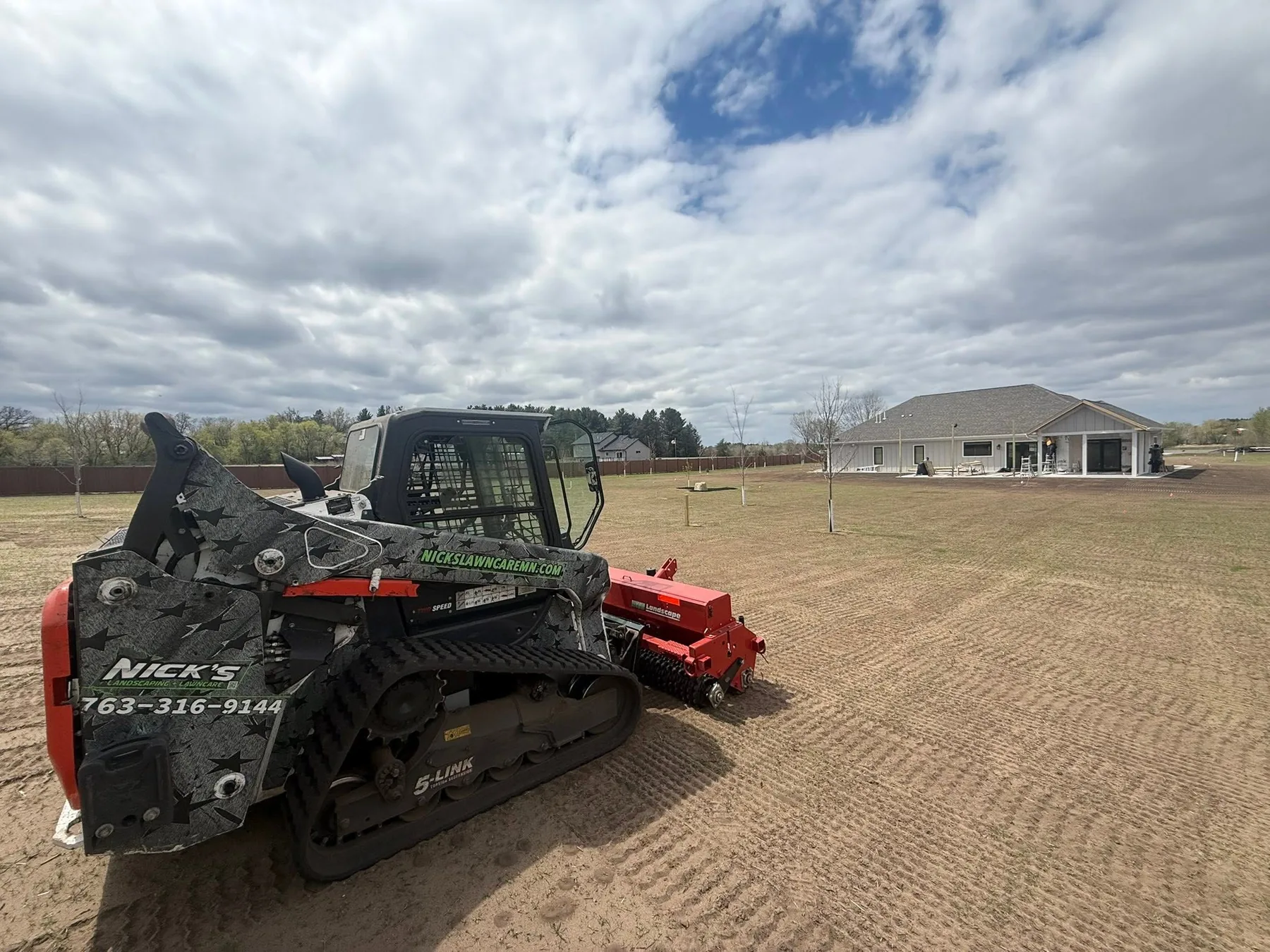 Nick's landscaping equipment at work preparing a property